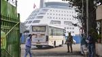 A tourist bus arrives at the International Cruise Terminal to pick up the passengers from the Covid-hit Cordelia cruise ship. (PTI) A tourist bus arrives at the International Cruise Terminal to pick up the passengers from the Covid-hit Cordelia cruise ship. (PTI)