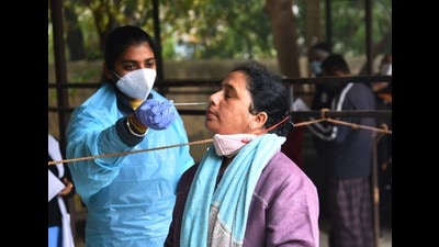 A hbeealth worker collecting swab sample for Covid-19 test in Gurugram on Wednesday. (Vipin Kumar/HT) A hbeealth worker collecting swab sample for Covid-19 test in Gurugram on Wednesday. (Vipin Kumar/HT)