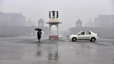 Light rain persisted throughout the day, and maximum temperature fell to 15.7 degrees Celsius, four notches below normal. (Sanjeev Verma/HT Photo) Light rain persisted throughout the day, and maximum temperature fell to 15.7 degrees Celsius, four notches below normal. (Sanjeev Verma/HT Photo)
