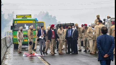 Police personnel and officials at the flyover where Prime Minister Narendra Modi's convoy stuck due to a blockade by a group of protestors, in Ferozepur. (PTI Photo) Police personnel and officials at the flyover where Prime Minister Narendra Modi's convoy stuck due to a blockade by a group of protestors, in Ferozepur. (PTI Photo)