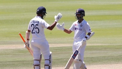 Cricket - Second Test - South Africa v India - Imperial Wanderers Stadium, Johannesburg, South Africa - January 5, 2022 India's Ajinkya Rahane celebrates his half century with Cheteshwar Pujara REUTERS/Rogan Ward (REUTERS)