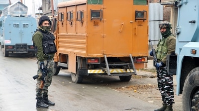 Security personnel stand guard near the encounter site, at Okay village in Kulgam on Tuesday.&nbsp; (ANI Photo)
