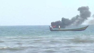 One of the boats set on fire during clashes between fishermen. (ANI Photo)