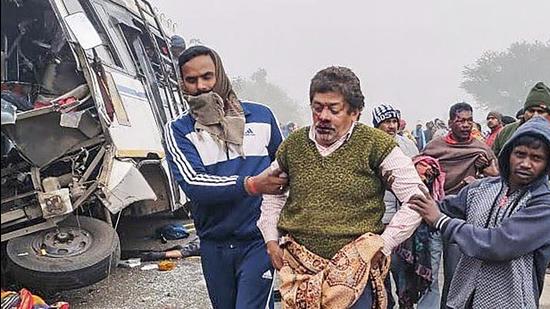 Pakur: An injured passenger being taken to a hospital for treatment after a bus collided with a truck on Govindpur-Sahibganj National Highway, in Pakur district of Jharkhand, Wednesday, Jan. 5, 2022. (PTI Photo)(PTI01_05_2022_000053B) (PTI) Pakur: An injured passenger being taken to a hospital for treatment after a bus collided with a truck on Govindpur-Sahibganj National Highway, in Pakur district of Jharkhand, Wednesday, Jan. 5, 2022. (PTI Photo)(PTI01_05_2022_000053B) (PTI)