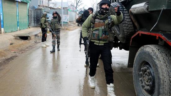 Security personnel at the encounter site in Chandgam area of Pulwama on Wednesday. Security personnel at the encounter site in Chandgam area of Pulwama on Wednesday.