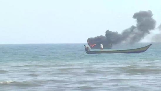 One of the boats set on fire during clashes between fishermen.(ANI Photo)