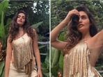 Gabriella Demetriades' New Year outfit was all about keeping it basic yet trendy. The entrepreneur dazzled in a shimmery backless strappy top and a short asymmetrical skirt.(Instagram/@gabriellademetriades)