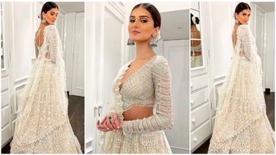 Tara Sutaria looked like a vision in this embellished lehenga set by Falguni and Shane Peacock. Sharing her photos on Instagram, she captioned the post, "Winter whites & weddings." (Instagram/#tarasutaria) Tara Sutaria looked like a vision in this embellished lehenga set by Falguni and Shane Peacock. Sharing her photos on Instagram, she captioned the post, "Winter whites & weddings." (Instagram/#tarasutaria)