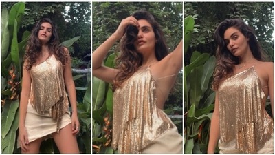 Gabriella Demetriades' New Year outfit was all about keeping it basic yet trendy. The entrepreneur dazzled in a shimmery backless strappy top and a short asymmetrical skirt. (Instagram/@gabriellademetriades) Gabriella Demetriades' New Year outfit was all about keeping it basic yet trendy. The entrepreneur dazzled in a shimmery backless strappy top and a short asymmetrical skirt. (Instagram/@gabriellademetriades)