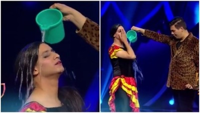 Karan Johar pours water on Rohit Thakur. Karan Johar pours water on Rohit Thakur.