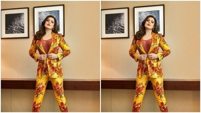 Zareen played muse to fashion designer Ranbir Mukherjee and picked a bright yellow pant suit with floral details. (Instagram/@zareenkhan)
