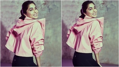 Sharvari teamed the sports bra with high-waisted gym tights featuring sheer panes and a bodycon fit. She layered the outfit with a cropped jacket in the bright pink shade with an open front, raised collars, back hoodie, drop-shoulders, and full sleeves. (Instagram/@sharvari) Sharvari teamed the sports bra with high-waisted gym tights featuring sheer panes and a bodycon fit. She layered the outfit with a cropped jacket in the bright pink shade with an open front, raised collars, back hoodie, drop-shoulders, and full sleeves. (Instagram/@sharvari)