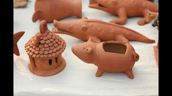 Terracotta holders and toys are quite a cute takeaway from this bazaar. (Photo: Manoj Verma/HT)
