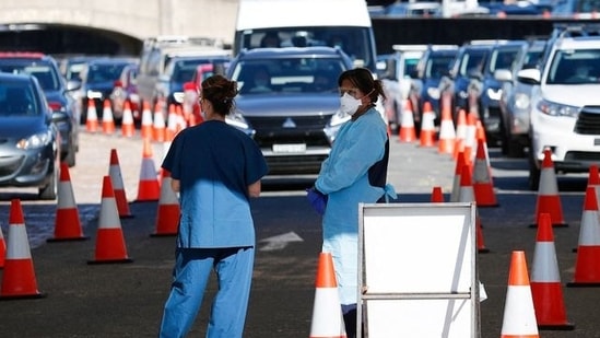 Healthcare workers wait for the next vehicle at a Covid-19 testing clinic as the Omicron coronavirus variant continues to spread in Sydney, Australia.&nbsp;(Reuters file photo)