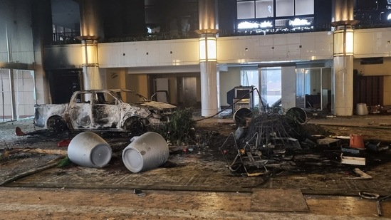 A burned car is seen inside the Presidential Residence which was stormed by demonstrators during the protests triggered by fuel price increase in Almaty, Kazakhstan.(REUTERS)