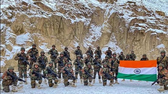 Indian Army soldiers pose for a photograph with the national flag on the occasion of New Year 2022, at the Galwan Valley in Ladakh. The photograph was released on January 4, a response to Chinese authorities releasing a video of their troops with their flag at the Galwan Valley. (PTI) Indian Army soldiers pose for a photograph with the national flag on the occasion of New Year 2022, at the Galwan Valley in Ladakh. The photograph was released on January 4, a response to Chinese authorities releasing a video of their troops with their flag at the Galwan Valley. (PTI)