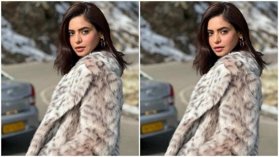 She layered her look with high back boots and posed in the snow.(Instagram/@aamnasharifofficial)