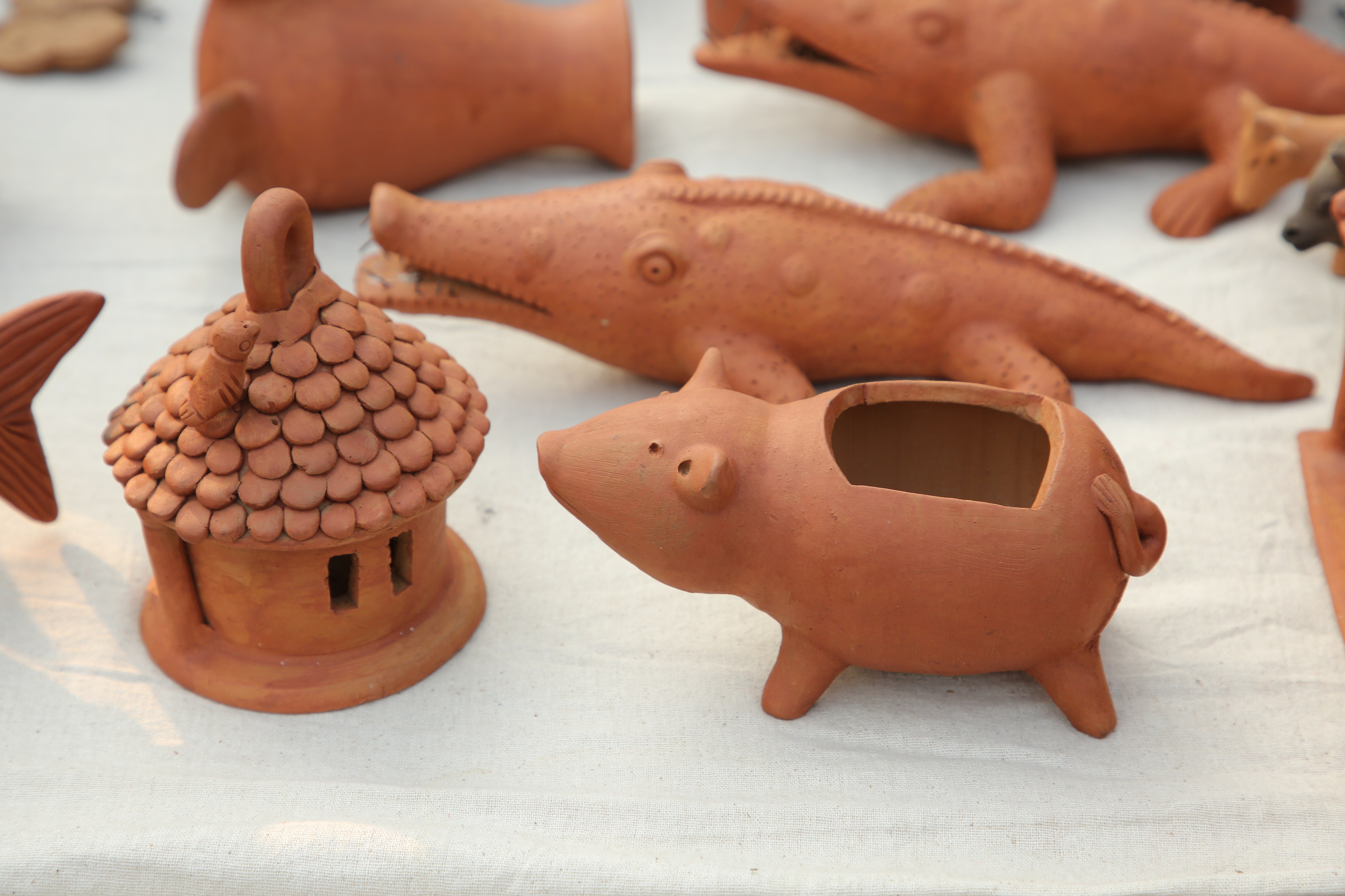 Terracotta holders and toys are quite a cute takeaway from this bazaar. (Photo: Manoj Verma/HT)