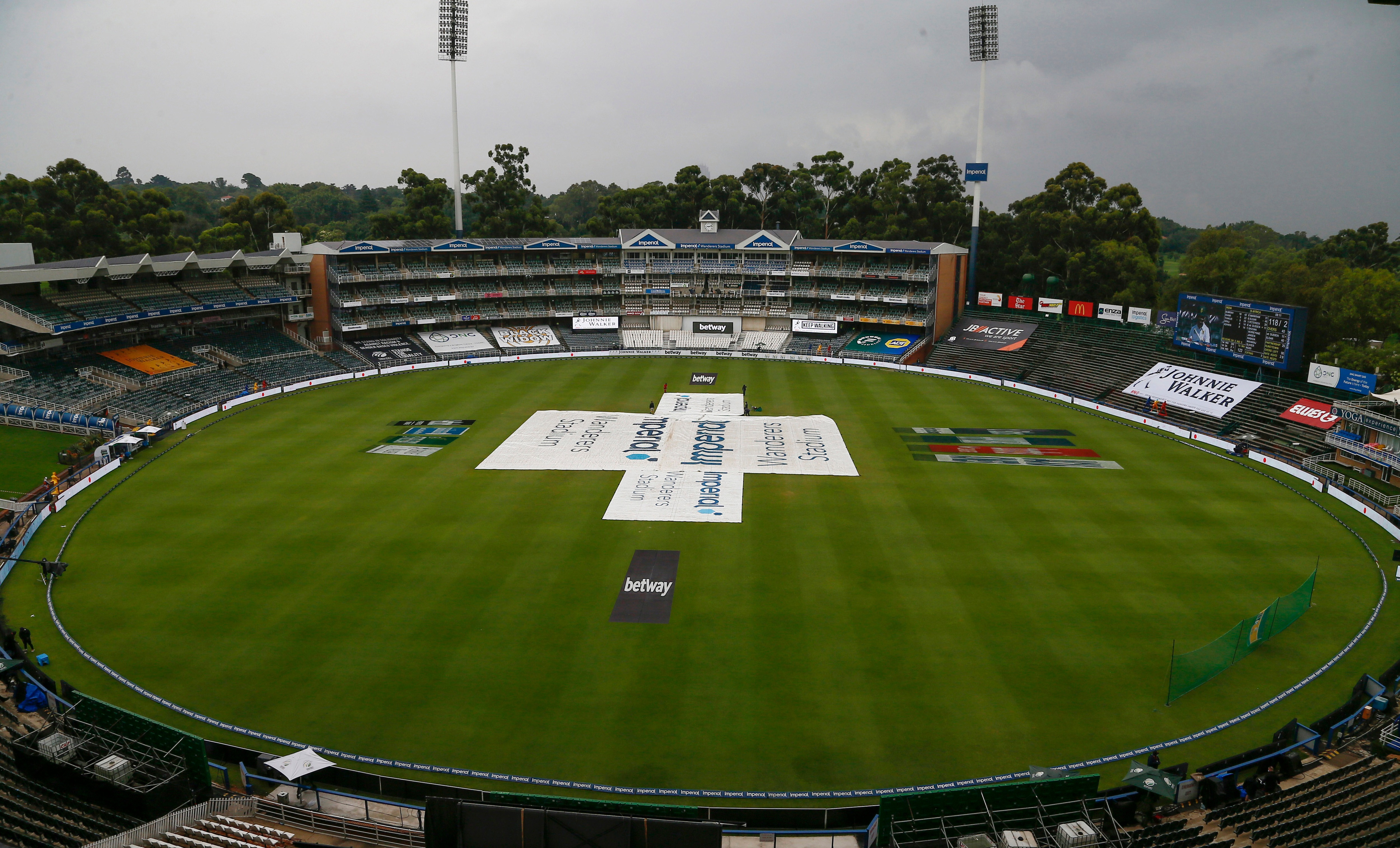 Johannesburg: The covers are pulled over the pitched as rain delayed play at the start of the fourth day of the second cricket test match between South Africa and India at the Wanderers stadium in Johannesburg, South Africa, Thursday, Jan. 6, 2022. (AP)