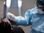 A person gets tested for the coronavirus disease (Covid-19) amid a potential third wave of infections caused by the spread of the Omicron variant.&nbsp;