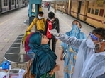 Covid testing going on at a platform of a Mumbai railway station on Friday. (AFP) Covid testing going on at a platform of a Mumbai railway station on Friday. (AFP)