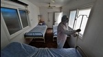 A health worker prepares beds at a portable cabin in Thane Civil Hospital, Thane, on Friday. As per the TMC records, 71% of current active cases in Thane concentrated in 3 wards alone – Majiwada-Manpada, Vartak Nagar and Uthalsar. (PRAFUL GANGURDE / HT PHOTO) A health worker prepares beds at a portable cabin in Thane Civil Hospital, Thane, on Friday. As per the TMC records, 71% of current active cases in Thane concentrated in 3 wards alone – Majiwada-Manpada, Vartak Nagar and Uthalsar. (PRAFUL GANGURDE / HT PHOTO)