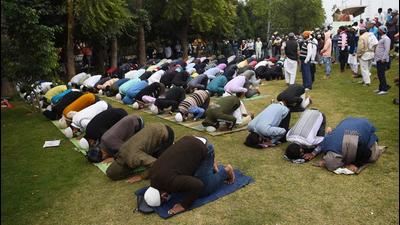 People offer namaz at a park, in Gurugram on Friday. (Vipin Kumar /HT PHOTO)