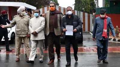 Chandigarh BJP president Arun Sood, along with other senior party leaders, coming out from Punjab Raj Bhawan in Chandigarh after submitting a memorandum on Prime Minister Narendra Modi’s security breach. (Ravi Kumar/HT)