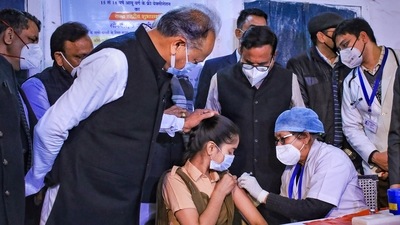 A health worker administers a Covid-19 vaccine to a teenager in presence of Rajasthan Chief Minister Ashok Gehlot, in Jaipur,&nbsp; (PTI)