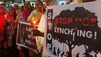 Women hold placards and candles during a protest against the recent mob lynchings across the country, in Ahmedabad, India, June 27, 2019. REUTERS/Amit Dave (REUTERS) Women hold placards and candles during a protest against the recent mob lynchings across the country, in Ahmedabad, India, June 27, 2019. REUTERS/Amit Dave (REUTERS)