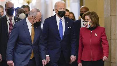 US President Joe Biden is flanked by Senate Majority Leader Chuck Schumer (left) and House Speaker Nancy Pelosi (right) after arriving on Capitol Hill in Washington, on Thursday. Joe Biden will deliver his first State of the Union address on March 1. (AP) US President Joe Biden is flanked by Senate Majority Leader Chuck Schumer (left) and House Speaker Nancy Pelosi (right) after arriving on Capitol Hill in Washington, on Thursday. Joe Biden will deliver his first State of the Union address on March 1. (AP)