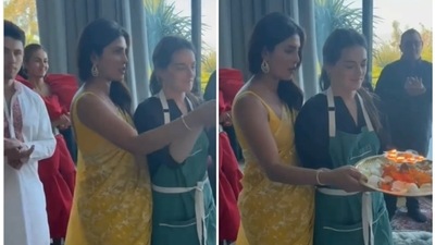 Priyanka Chopra and chef Sami Udell perform aarti during Lakshmi puja. Priyanka Chopra and chef Sami Udell perform aarti during Lakshmi puja.