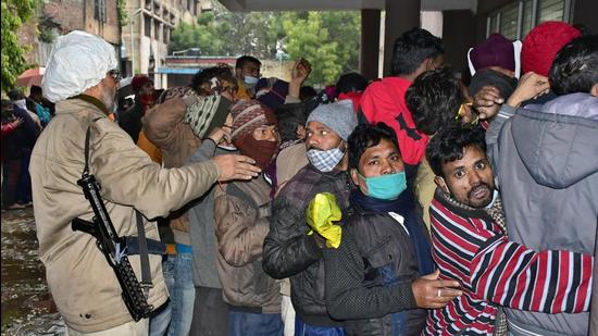 The queue grew longer after the vaccination centre opened an hour late. One of the persons, Surinder Kumar of Kundan Puri, said he had arrived at the vaccination unit at around 8am, but no one was present. (Harsimar Pal Singh/HT)
