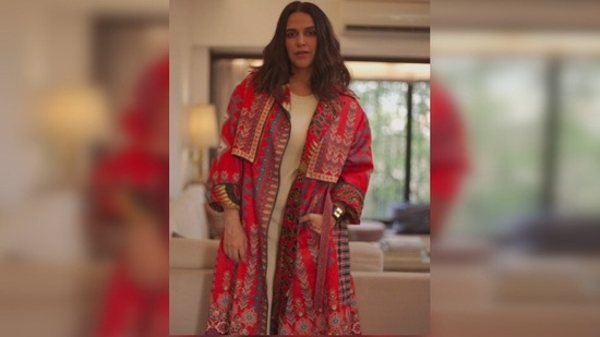 Neha Dhupia looks stunning in this trench coat inspired jacket with a touch of Indian textures and colours.(Instagram/@nehadhupia)
