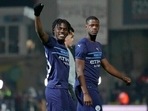 Manchester City's Romeo Lavia, left, waves to the crowd after the English FA Cup third round soccer match between Swindon Town and Manchester City at the County Ground stadium in Swindon, Wiltshire, England.