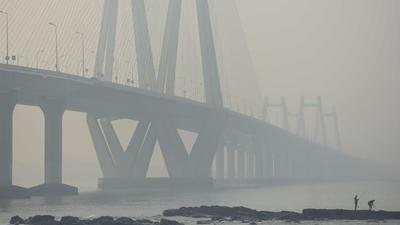 Mumbai, Fishermen with fishing rods catch fish near Bandra Worli sealink in hazy weather at Bandra Fort in Mumbai. IMD said the minimum temperature can fall to 15-16 degrees Celsius and the maximum, to about 24 to 26 degrees Celsius (Satish Bate/HT File Photo) Mumbai, Fishermen with fishing rods catch fish near Bandra Worli sealink in hazy weather at Bandra Fort in Mumbai. IMD said the minimum temperature can fall to 15-16 degrees Celsius and the maximum, to about 24 to 26 degrees Celsius (Satish Bate/HT File Photo)
