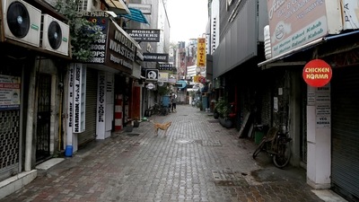 Shops are closed at Khan Market during a weekend curfew imposed by the Delhi government amid a rise in Covid-19 cases, in New Delhi. (ANI Photo) Shops are closed at Khan Market during a weekend curfew imposed by the Delhi government amid a rise in Covid-19 cases, in New Delhi. (ANI Photo)