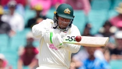 Australia's Usman Khawaja hits a four off England's James Anderson during the fourth day of their Ashes cricket test match in Sydney, Saturday, Jan. 8, 2022. (AP)