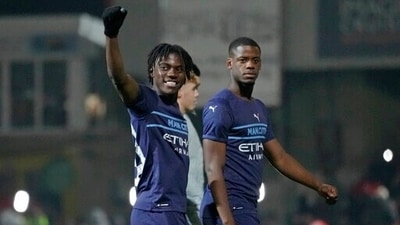 Manchester City's Romeo Lavia, left, waves to the crowd after the English FA Cup third round soccer match between Swindon Town and Manchester City at the County Ground stadium in Swindon, Wiltshire, England. (AP) Manchester City's Romeo Lavia, left, waves to the crowd after the English FA Cup third round soccer match between Swindon Town and Manchester City at the County Ground stadium in Swindon, Wiltshire, England. (AP)