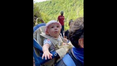 The image, taken from the video, shows the kid looking at the waterfall. (YouTube/@ Lisa Fleisher)