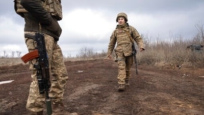 Ukrainian marines walk at the line of separation from pro-Russian rebels, Donetsk region, Ukraine. (AP) Ukrainian marines walk at the line of separation from pro-Russian rebels, Donetsk region, Ukraine. (AP)