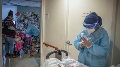 A nursing home resident, second from left, is given a COVID-19 vaccine in New York (File photo) (AP) A nursing home resident, second from left, is given a COVID-19 vaccine in New York (File photo) (AP)