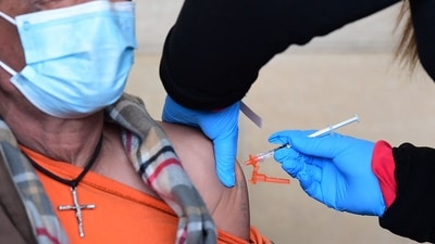 A man receives his Covid-19 vaccine at Union Station in Los Angeles, on January 7. (AFP Photo) A man receives his Covid-19 vaccine at Union Station in Los Angeles, on January 7. (AFP Photo)