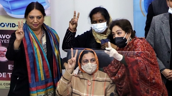 BJP councillor Sarabjit Kaur with Bharatiya Janata Party (BJP) MP Kirron Kher and others show victory signs after being appointed as new Mayor of Chandigarh Municipal Corporation, in Chandigarh on Saturday.&nbsp;(ANI)