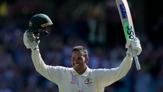 Usman Khawaja celebrates making 100 runs against England during the fourth day of their Ashes cricket test match in Sydney.(AP)