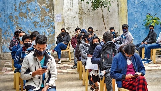 Beneficiaries in the 15 to 18 age group wait at a vaccination centre in New Delhi(Amal KS/HT Photo)