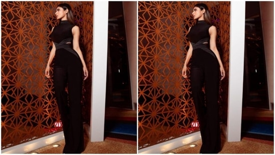 The co-ord set came with halter cut top, cut from the waist sides. She paired it with a black pair of high-waisted trousers with wide legs.(Instagram/@imouniroy)