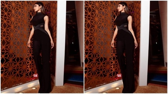 The co-ord set came with halter cut top, cut from the waist sides. She paired it with a black pair of high-waisted trousers with wide legs.(Instagram/@imouniroy)