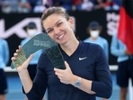Simona Halep of Romania with the winner's trophy after her singles match against Veronika Kudermetova of Russia during the women's final of the Summer Set 1 tournament ahead of the Australian Open in Melbourne, Australia, Sunday, Jan. 9, 2022(AP) Simona Halep of Romania with the winner's trophy after her singles match against Veronika Kudermetova of Russia during the women's final of the Summer Set 1 tournament ahead of the Australian Open in Melbourne, Australia, Sunday, Jan. 9, 2022(AP)