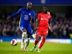 Chelsea's Romelu Lukaku, left, duels for the ball with Chesterfield's Saidou Khan during the English FA Cup third round soccer match between Chelsea and Chesterfield at Stamford Bridge.